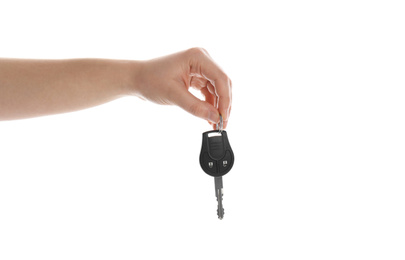 Photo of Woman holding key on white background, closeup. Car buying