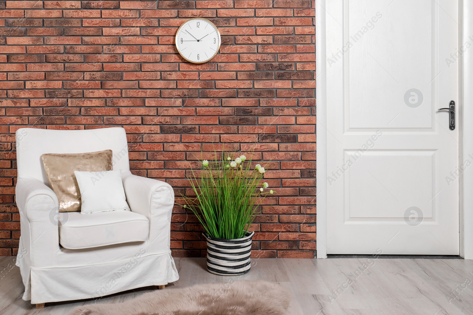 Photo of Modern room interior with white door and comfortable armchair