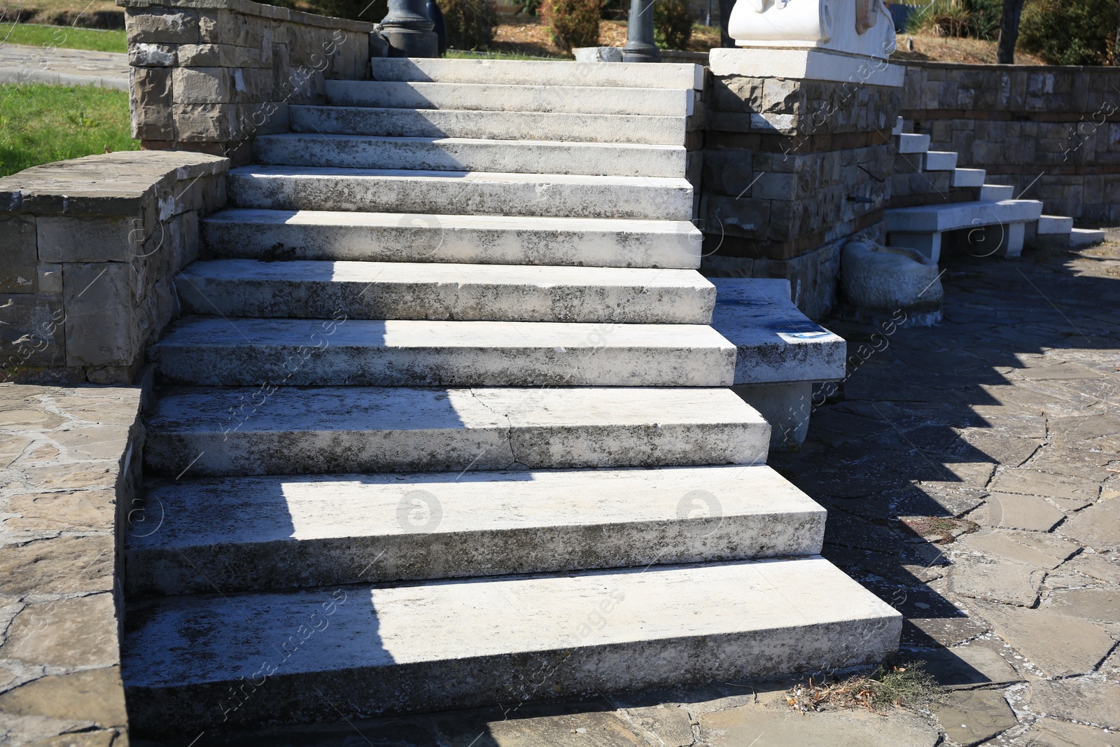 Photo of View of empty old concrete staircase outdoors on sunny day