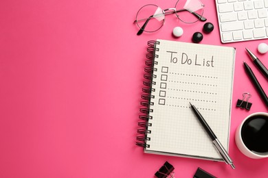 Flat lay composition with unfilled To Do list and cup of coffee on pink background, space for text