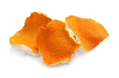 Photo of Dry orange fruit peels on white background