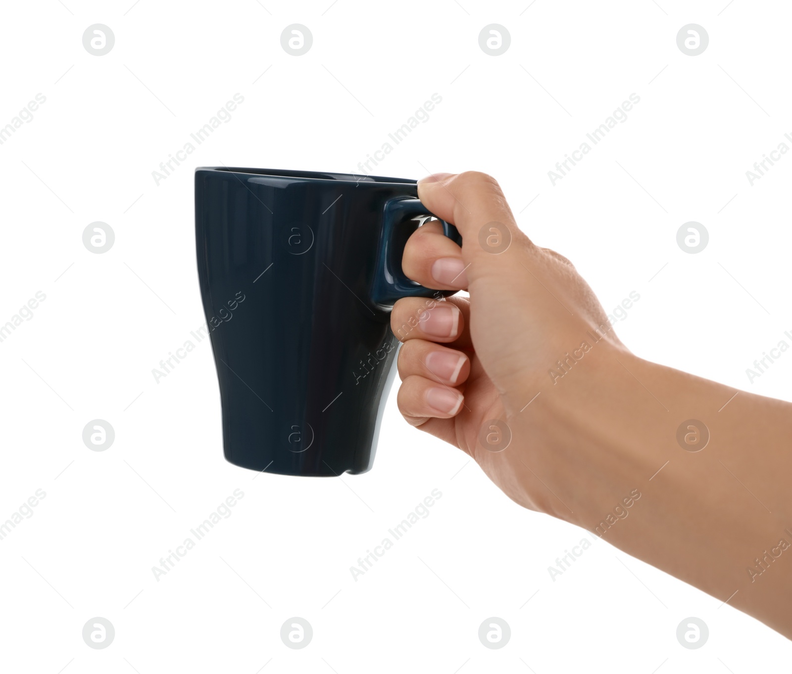 Photo of Woman holding elegant dark blue cup on white background, closeup
