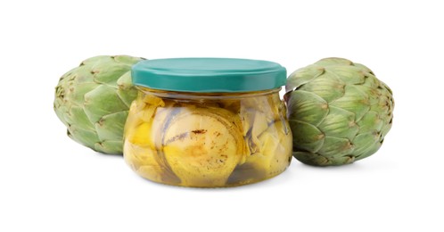 Photo of Jar of delicious artichokes pickled in olive oil and fresh vegetables on white background