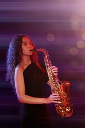 Image of Beautiful African American woman playing saxophone on dark background. Bokeh effect