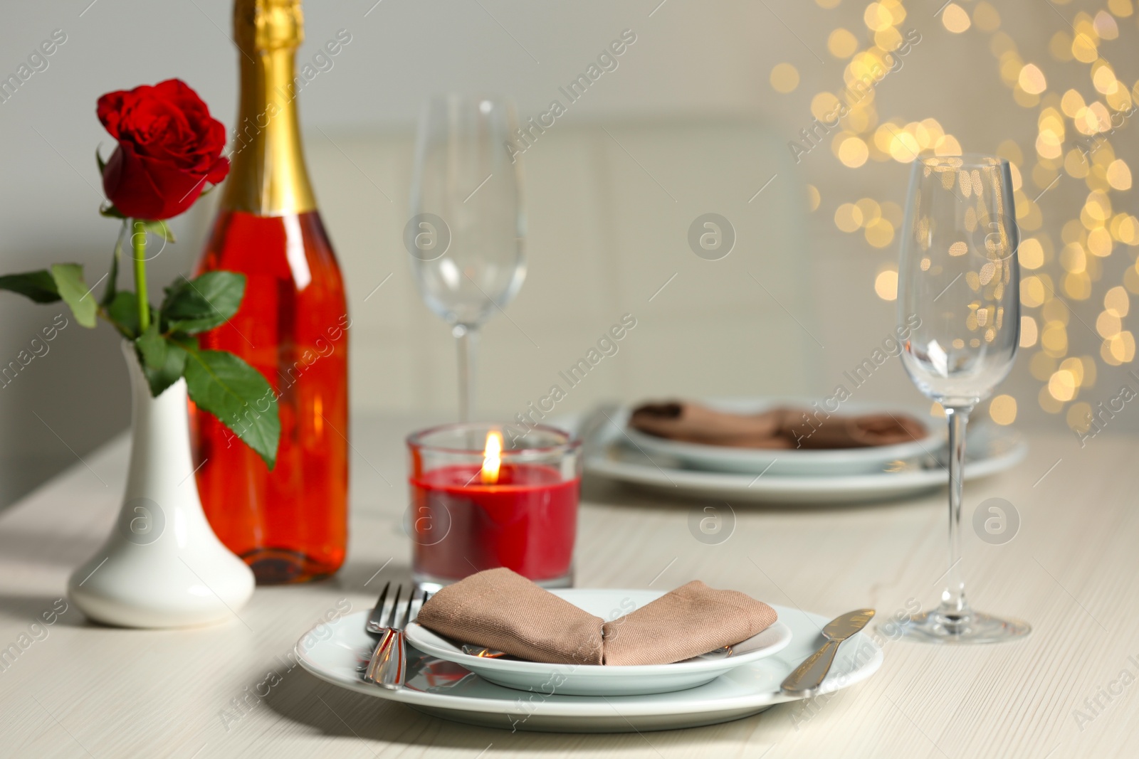 Photo of Beautiful table setting with burning candle and rose for romantic dinner