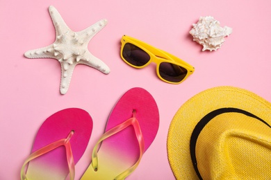 Flat lay composition with collection of beach objects on color background