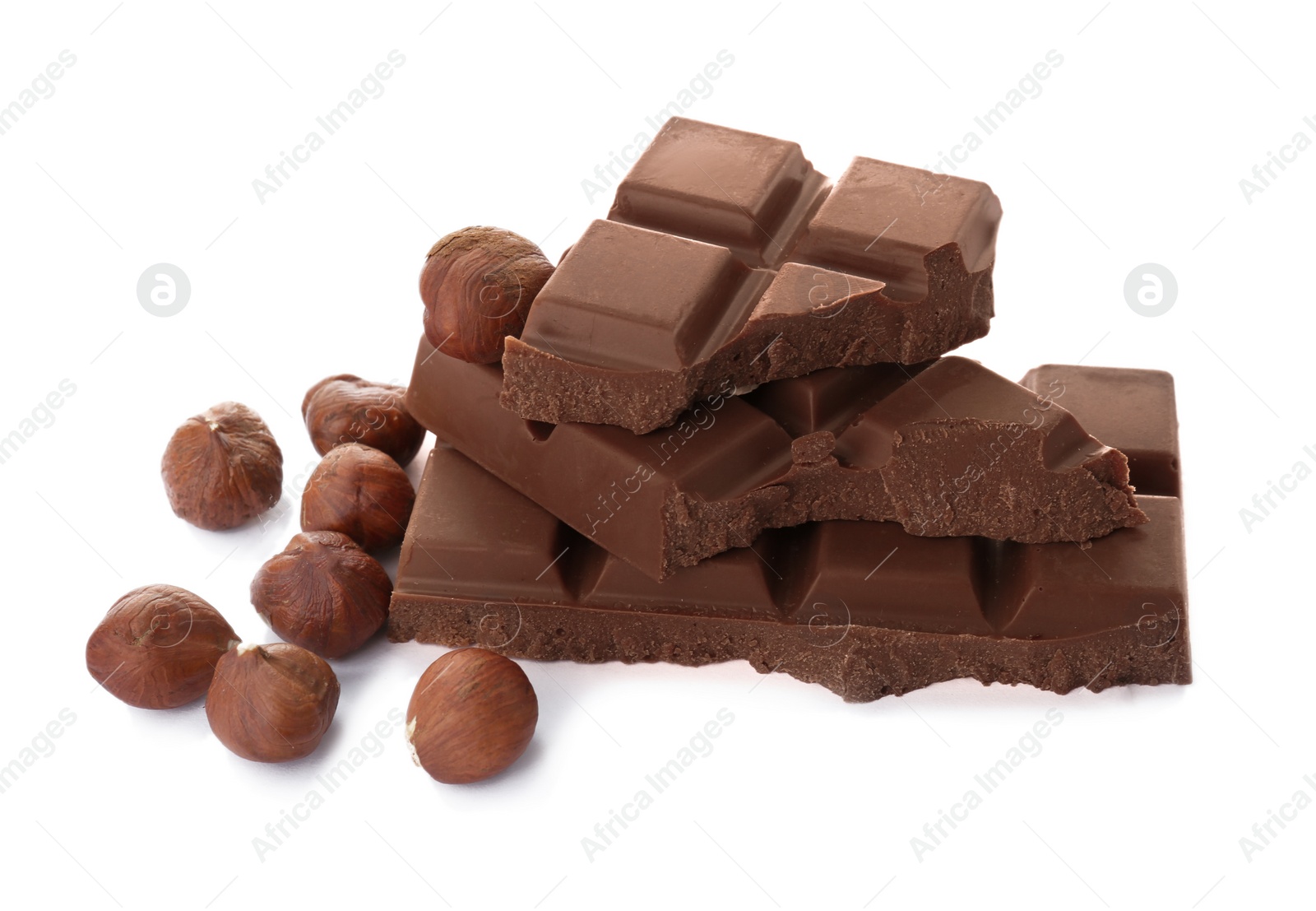 Photo of Delicious milk chocolate with nuts on white background