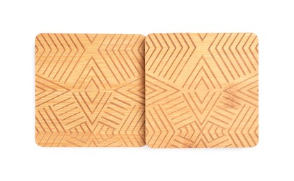 Stylish wooden cup coasters on white background, top view