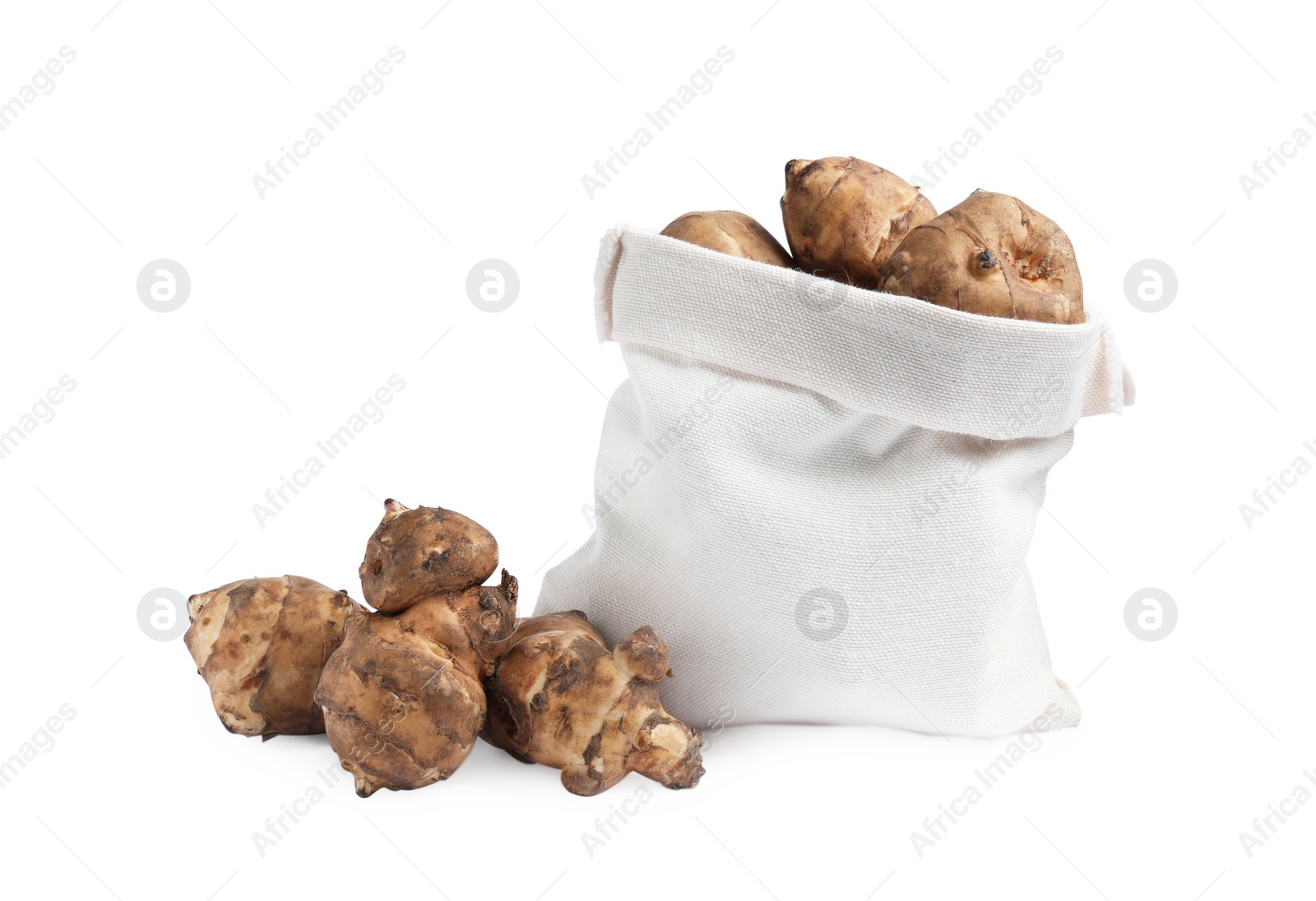 Photo of Bag and many Jerusalem artichokes isolated on white