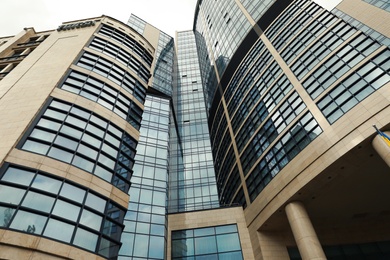 Photo of KYIV, UKRAINE - MAY 21, 2019: Low angle view of modern hotel HILTON