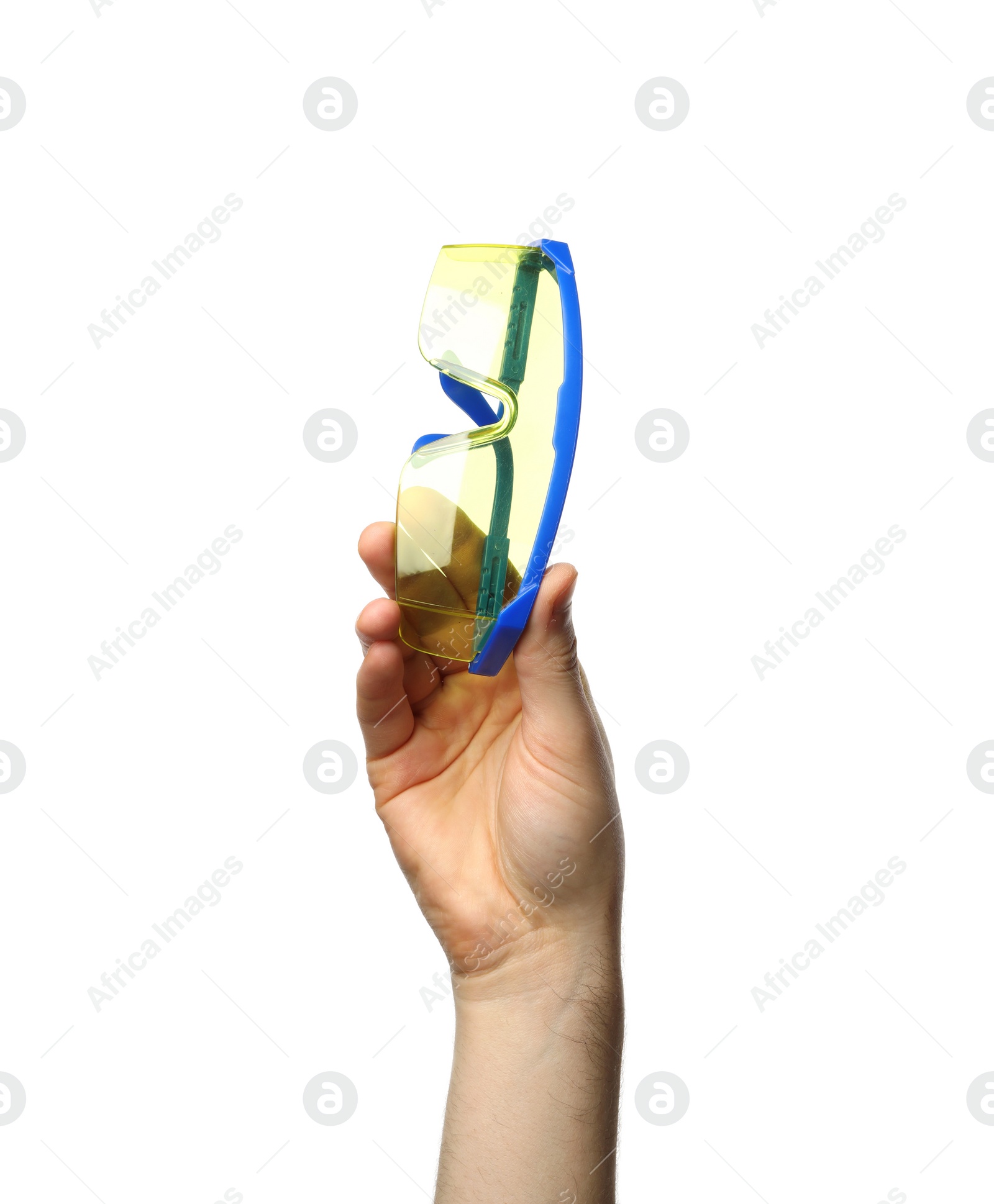 Photo of Man holding protective goggles isolated on white, closeup