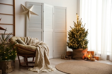 Stylish room interior with elegant Christmas decor
