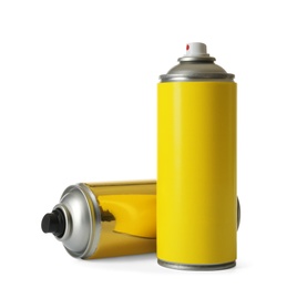 Photo of Cans of different spray paints on white background