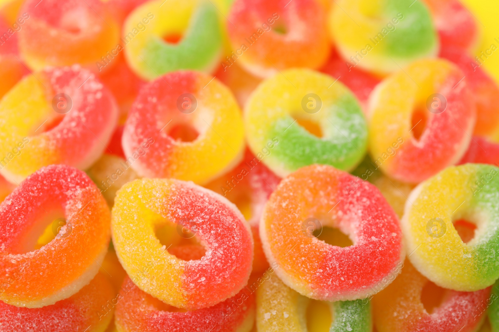 Photo of Many tasty jelly candies as background, closeup