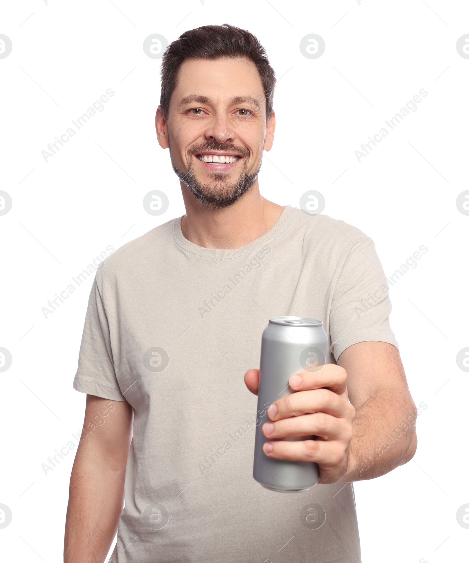 Photo of Happy man holding tin can with beverage on white background