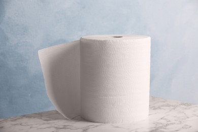 Roll of paper towels on white marble table