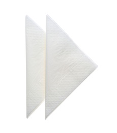 Photo of Folded clean paper tissues on white background, top view
