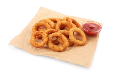 Photo of Tasty fried onion rings with ketchup isolated on white