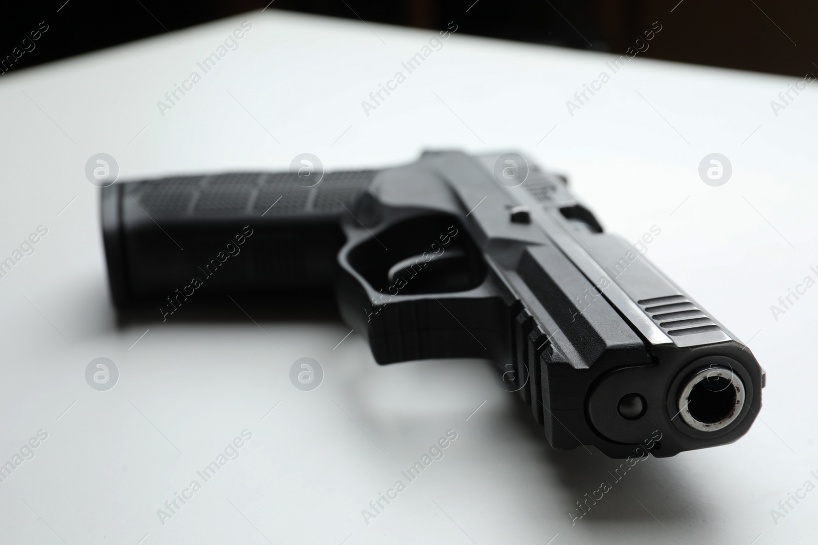 Photo of Semi-automatic pistol on white background, closeup. Standard handgun