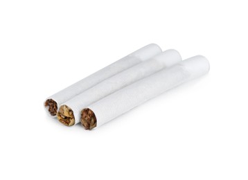 Photo of Hand rolled tobacco cigarettes on white background