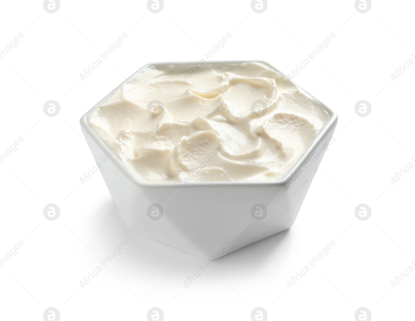 Photo of Bowl of tasty cream cheese on white background