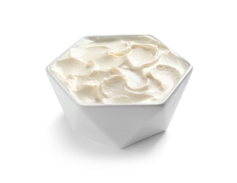 Bowl of tasty cream cheese on white background