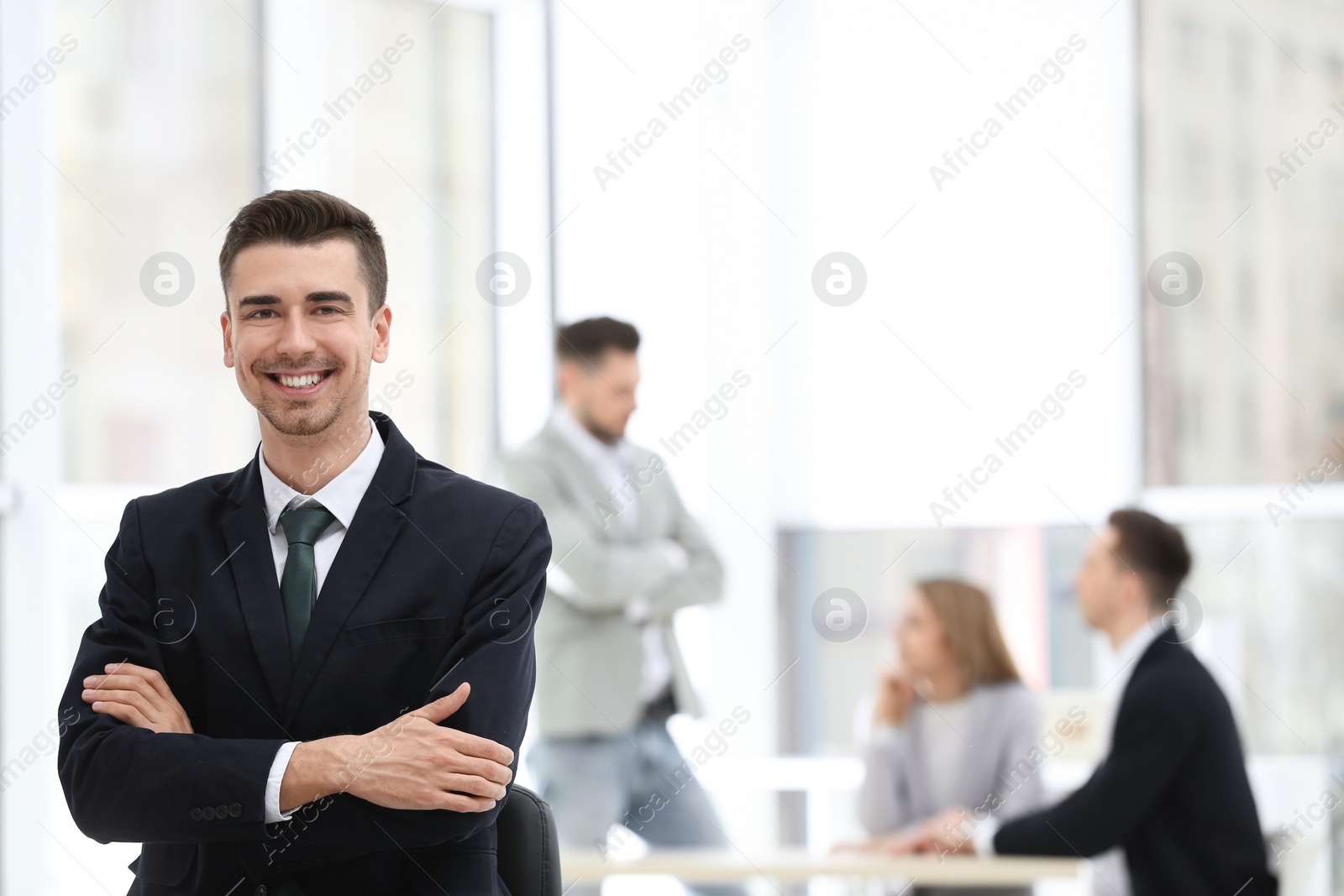 Photo of Portrait of handsome young businessman in office