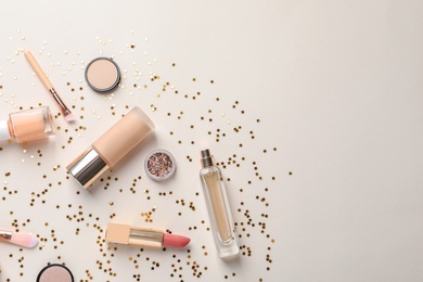 Photo of Flat lay composition with decorative cosmetics on color background