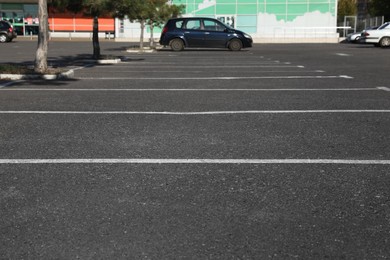 Car parking lot with white marking outdoors