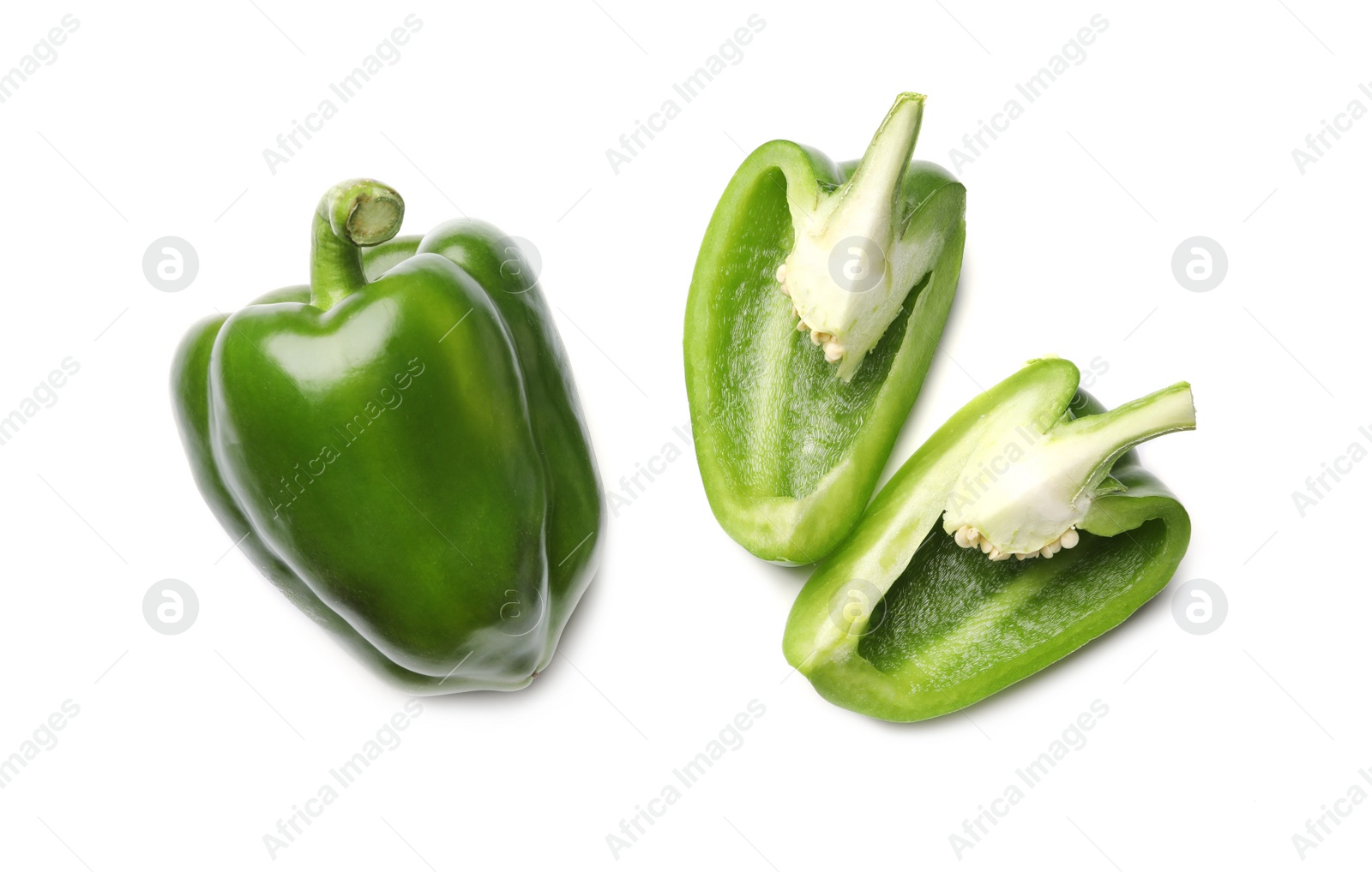 Photo of Whole and cut green bell peppers on white background, top view