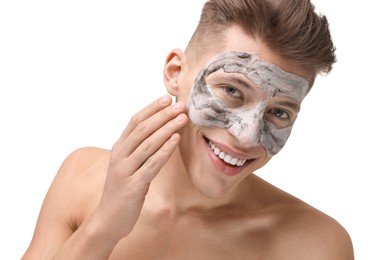 Photo of Handsome man with clay mask on his face against white background