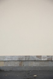 Photo of Beige wall of building outdoors. Exterior design