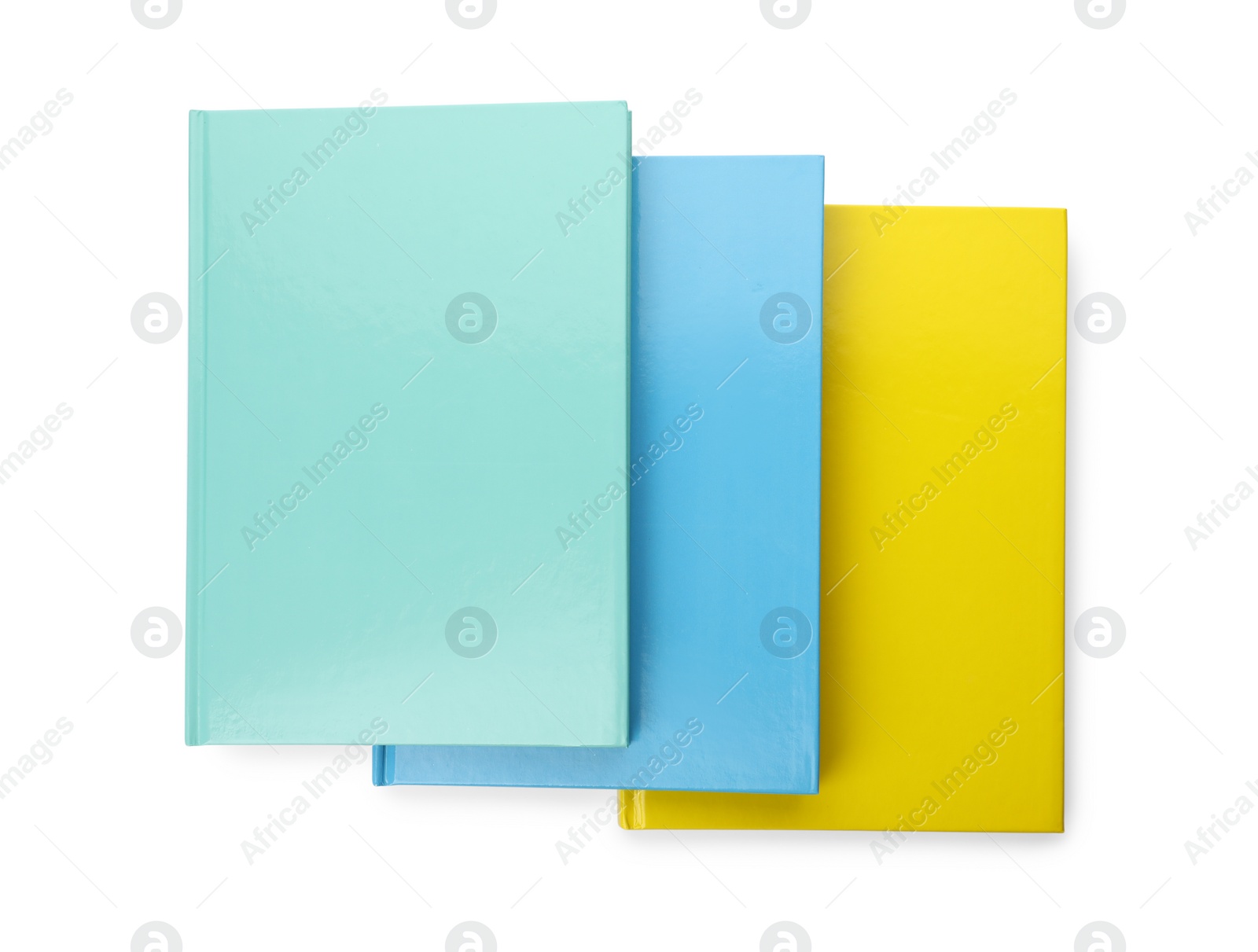 Photo of Different colorful hardcover planners on white background, top view