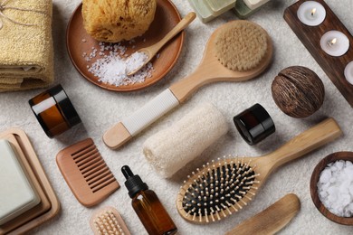 Flat lay composition with different spa products on light grey textured table