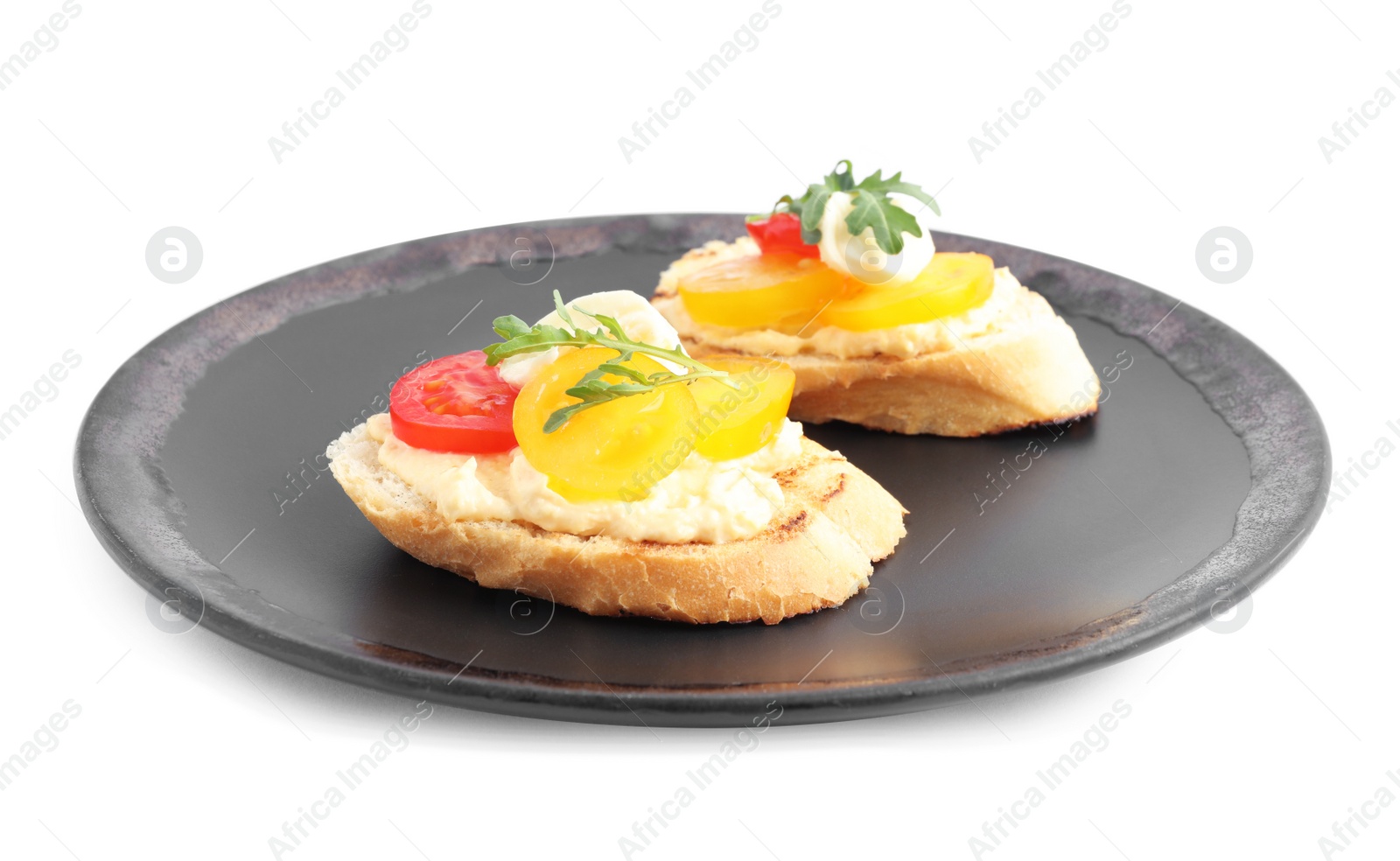 Photo of Plate of delicious tomato bruschettas on white background