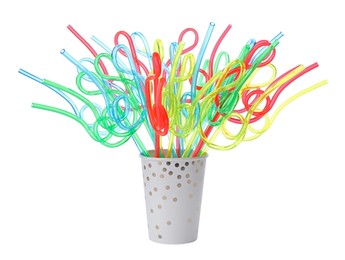 Photo of Color plastic cocktail tubes in paper cup on white background