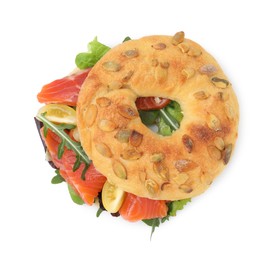 Photo of Tasty bagel with salmon and tomatoes isolated on white, top view