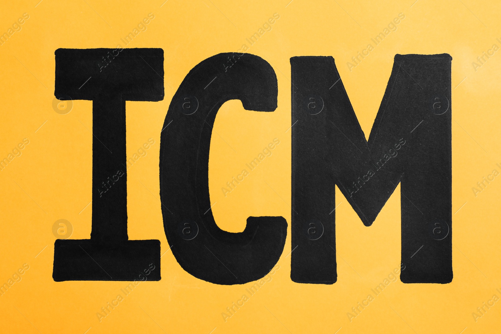 Photo of Abbreviation ICM (International Cash Management) on orange background