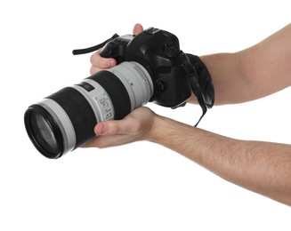 Photo of Photographer holding modern camera on white background, closeup