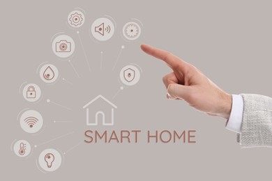 Image of Man using digital screen with Smart Home interface on beige background, closeup