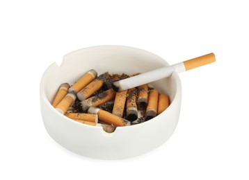 Photo of Ceramic ashtray with cigarette stubs isolated on white