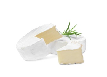 Photo of Tasty cut and whole brie cheeses with rosemary on white background