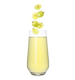 Image of Freshly made grape juice on white background. Cut and whole berries falling into glass