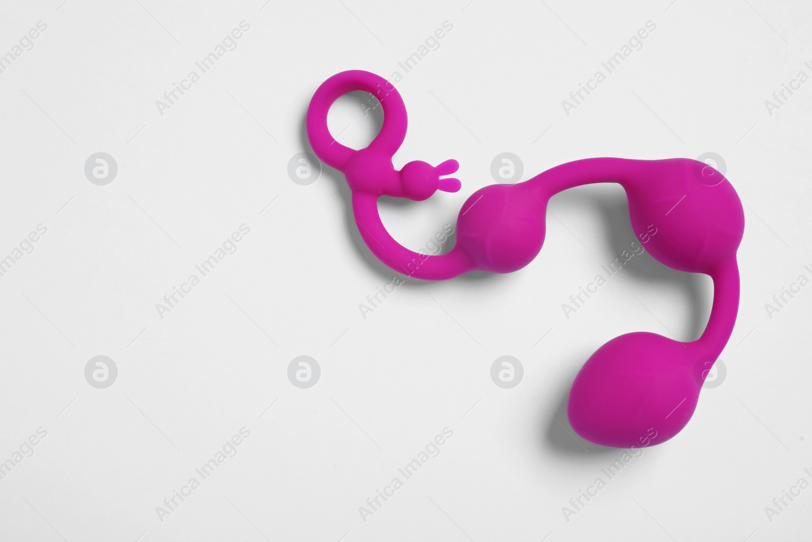 Photo of Anal balls on white background, top view. Sex toy