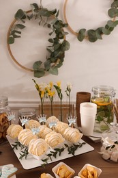 Photo of Tasty treats on table in room. Sweet buffet