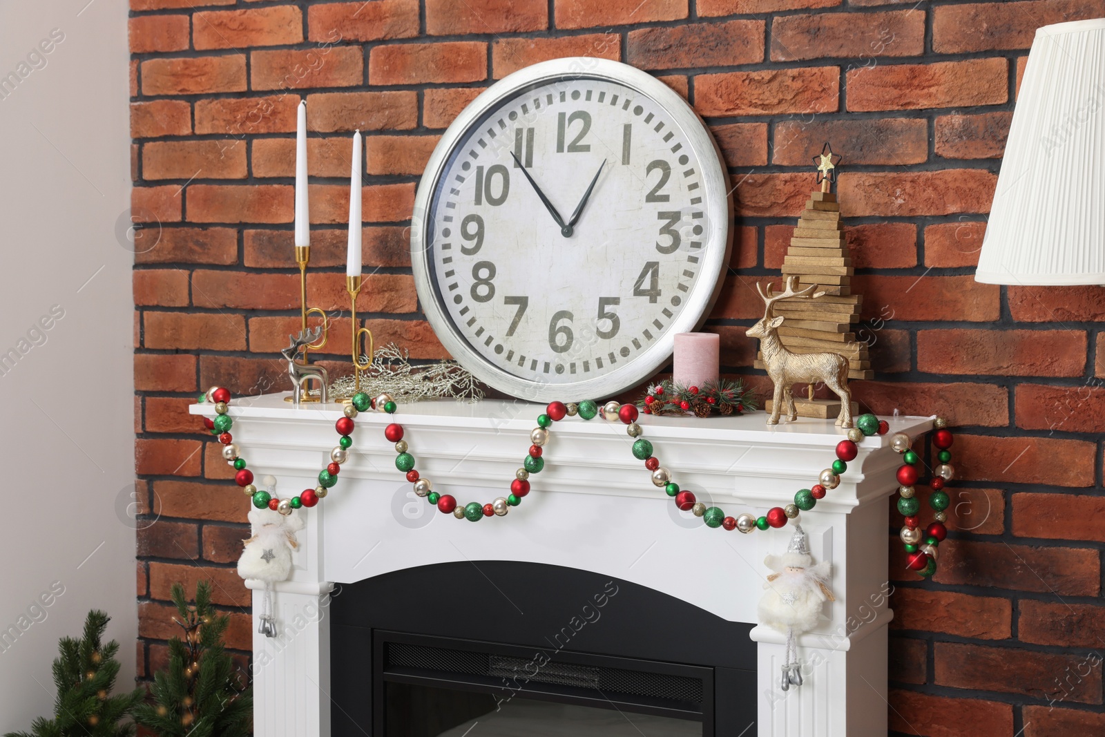 Photo of Modern fireplace decorated for Christmas in living room