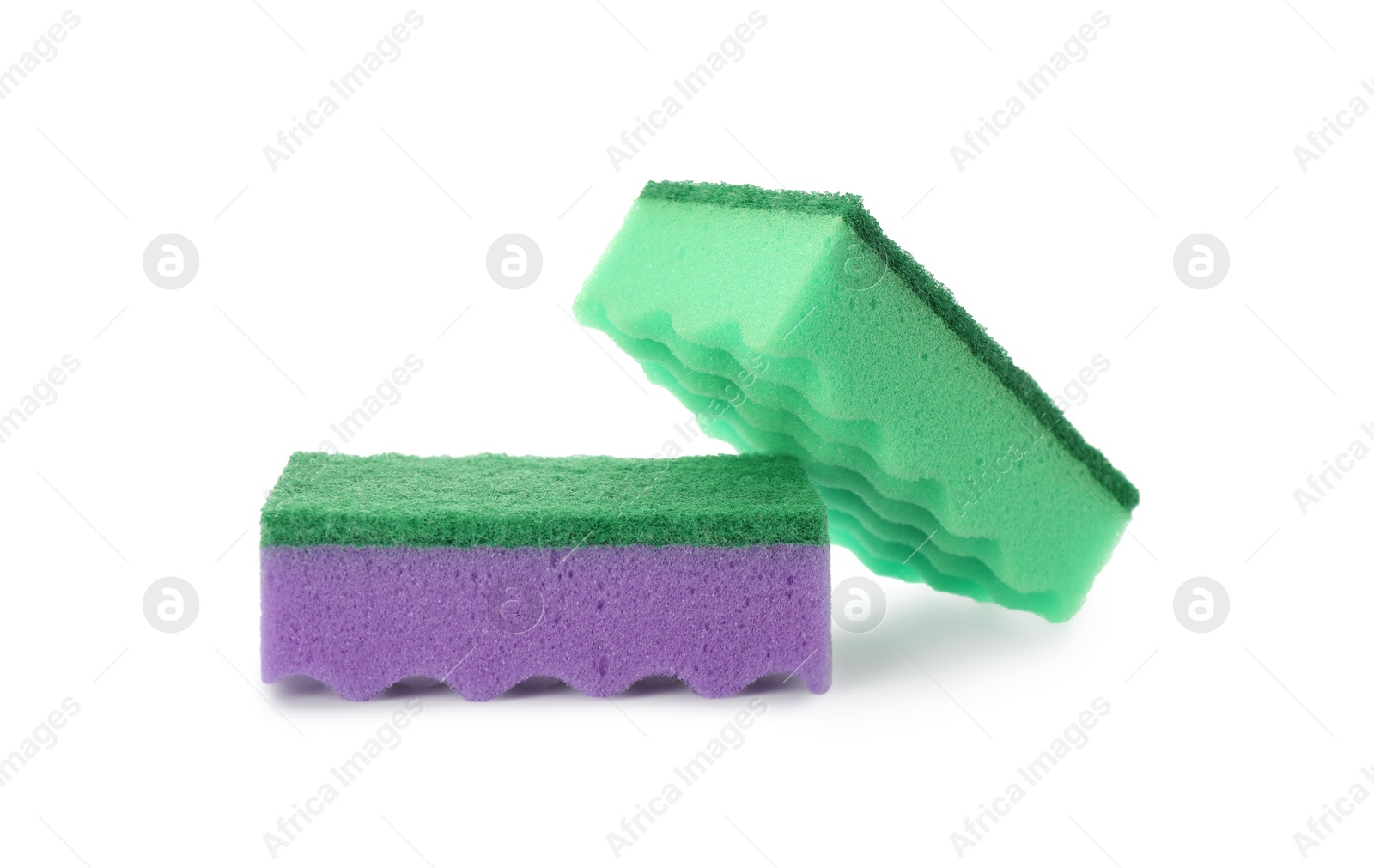 Photo of Bright cleaning sponges with abrasive scourers on white background