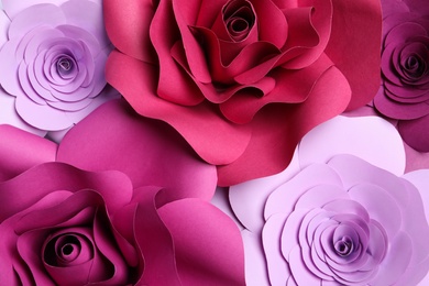 Different beautiful flowers made of paper as background, top view