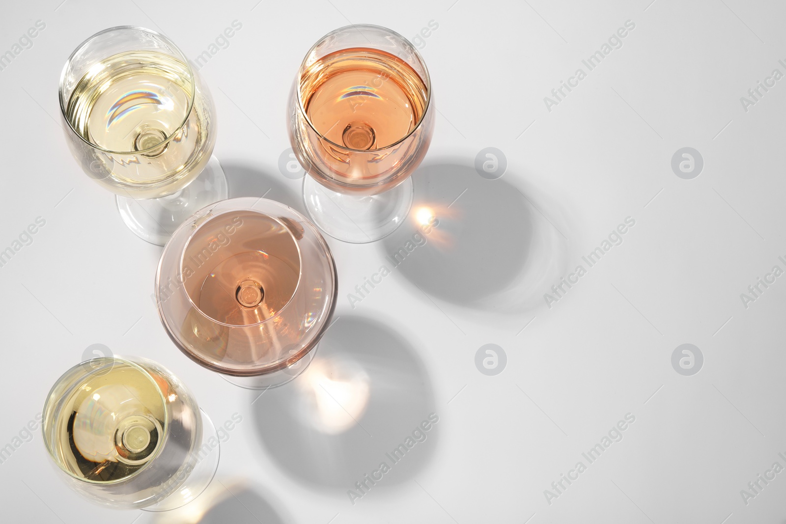 Photo of Tasty different wines in glasses isolated on white