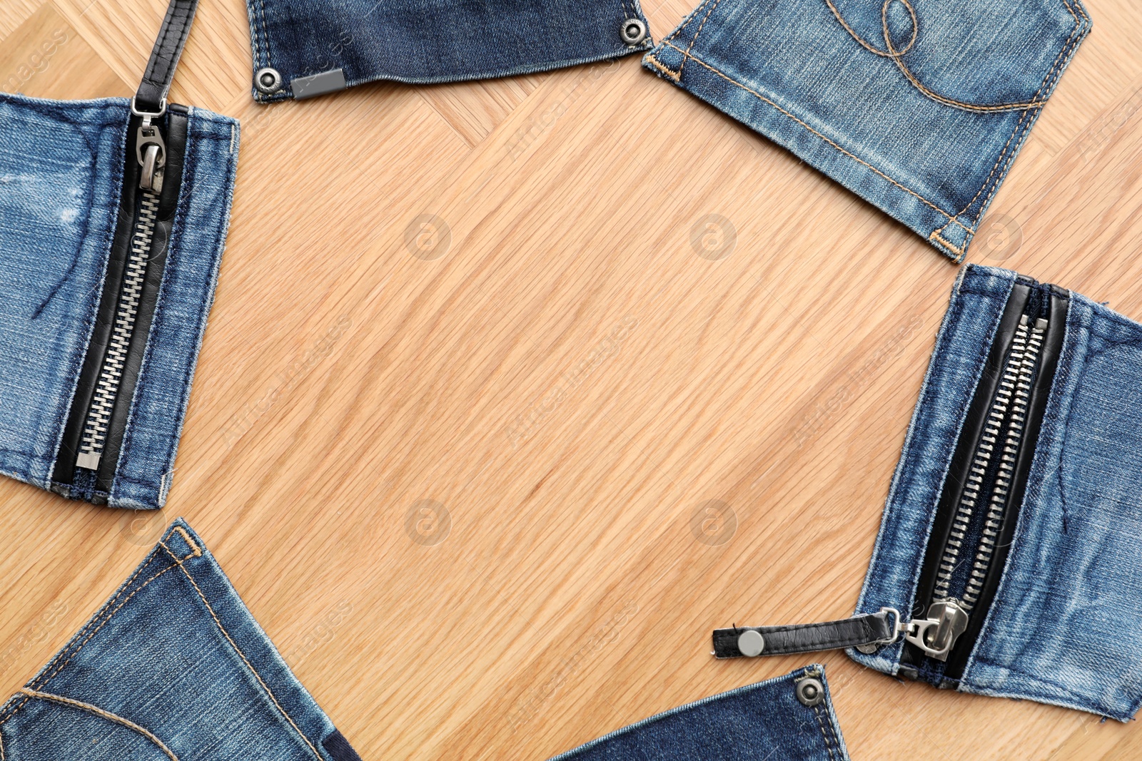 Photo of Frame made of jeans pockets on table, flat lay. Space for text